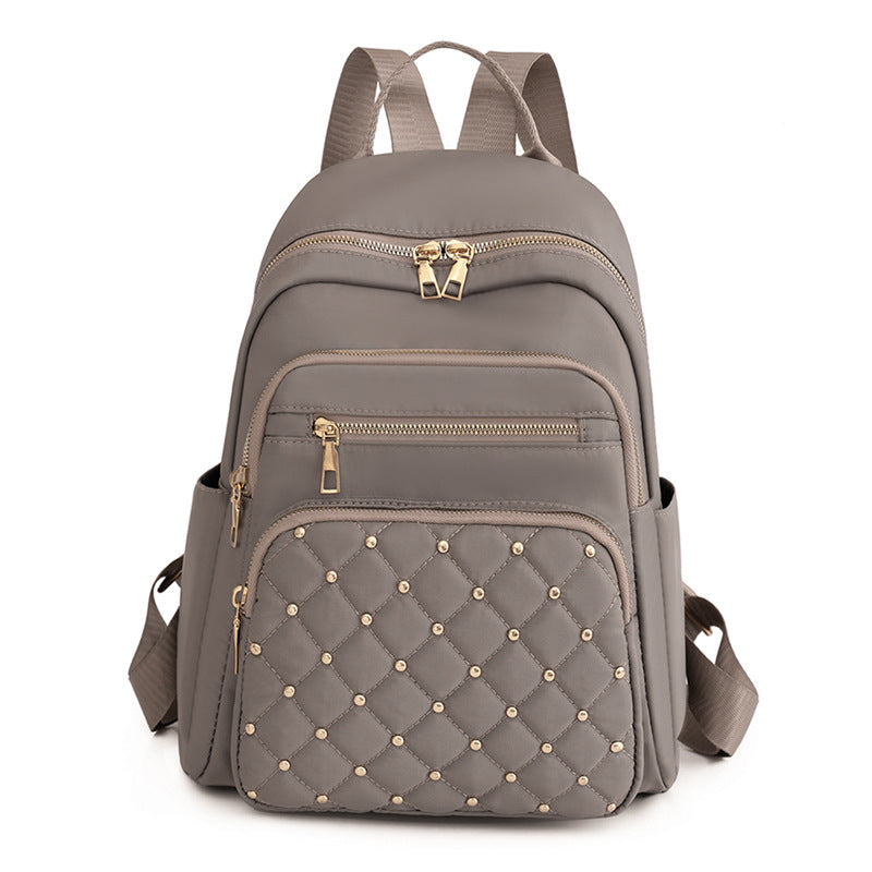 Solid color rhombus sewing line rivets fashion backpack women's 2025 texture Korean version large capacity simple women's backpack