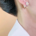 Luxury fashion floral earrings - unique studs, geometric ear cuffs, and accessories featuring geometric floral design details