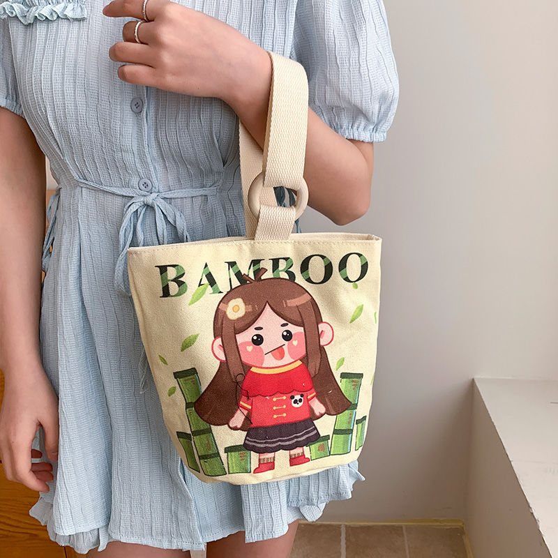 Cute cartoon canvas tote bag for women, 2024 new style handheld bucket bag, large capacity lunch bag, fashionable cloth handbag