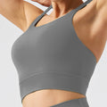 eco-friendly sports bra with thin straps, designed for yoga, running, and fitness. features built-in padding and is suitable for women