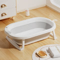 Newborn baby foldable bathtub with temperature-sensitive silicone plug, easy grip handles, and large capacity for baby bathing