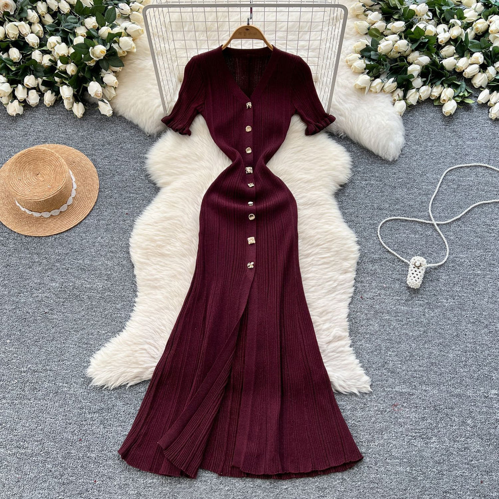 Elegant and sophisticated v-neck short-sleeve knit dress for women, perfect for summer. features a slimming, single-breasted design with a slit and shimmering silk details. a long, chic sweater dress