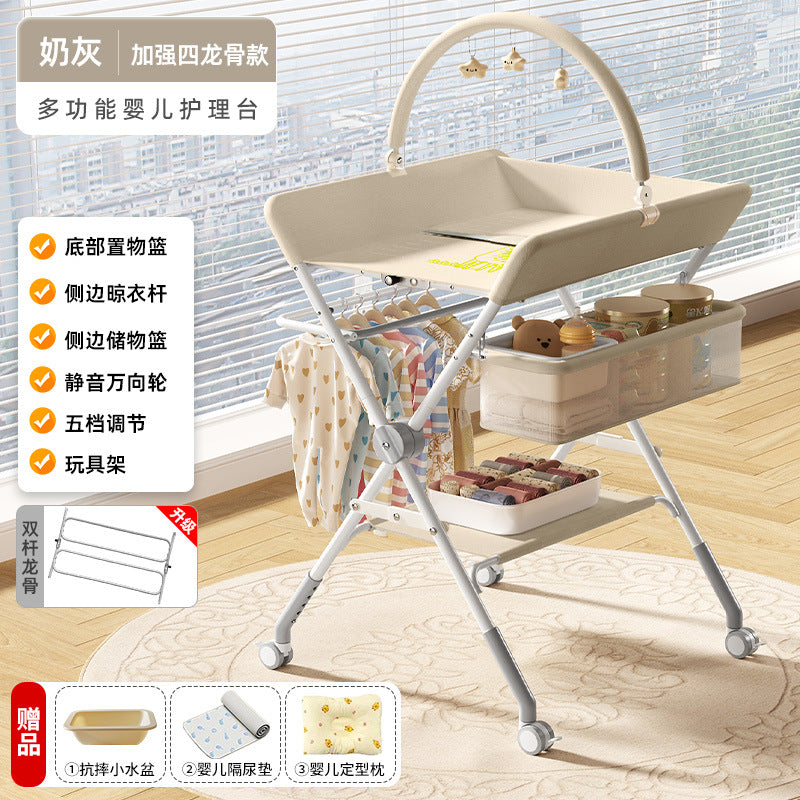Baby changing table - newborn diaper changing, bathing, and massage station - foldable multifunctional baby bed