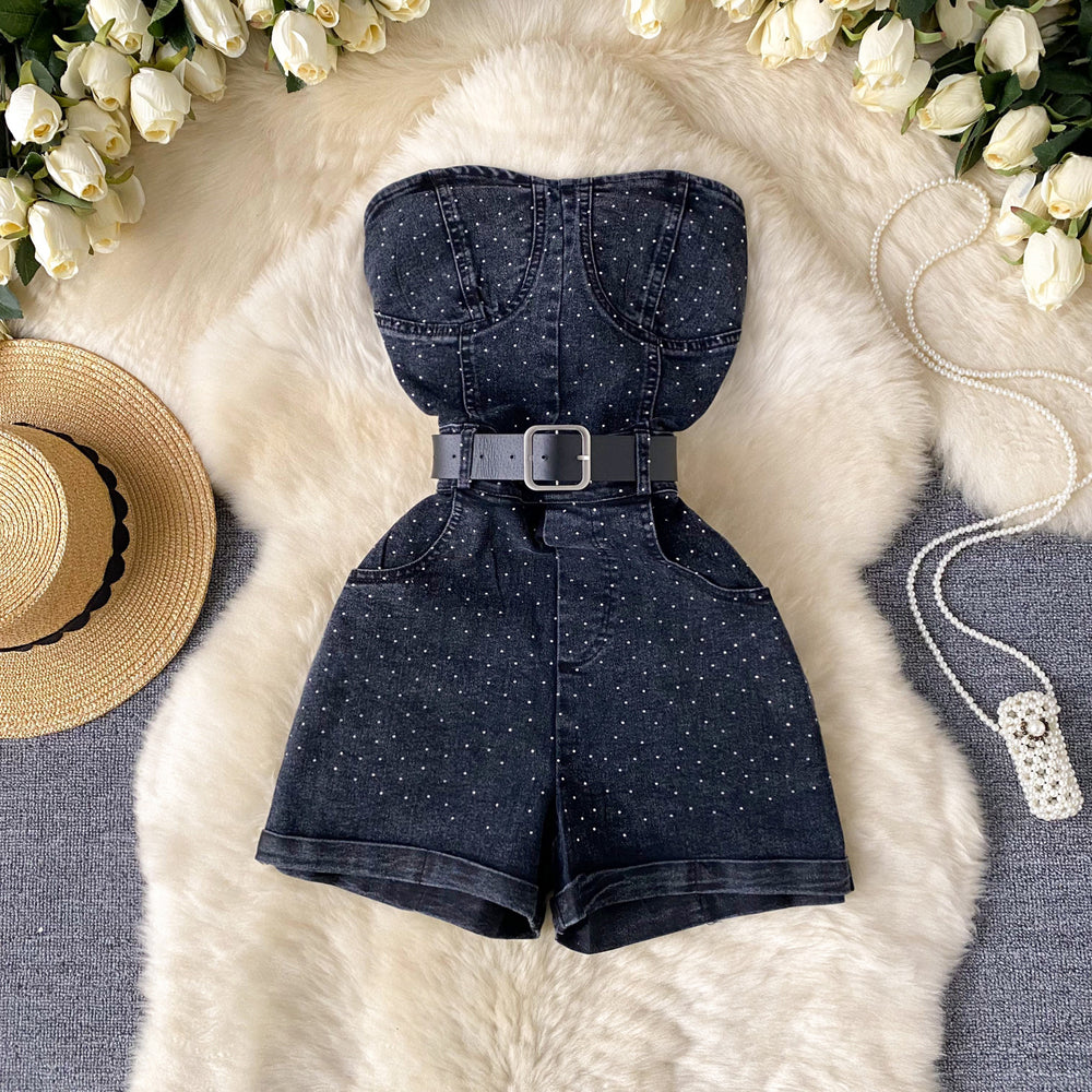 This year's trendy look for petite women: stylish, high-waisted, slim-fit, sleeveless, strapless jumpsuit with hot-fix rhinestone embellishments