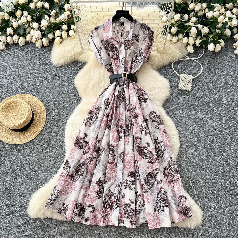 French chic, sophisticated, and unique: tie-waist, short-sleeve, single-breasted, fashionable printed pleated shirt dress with a touch of class
