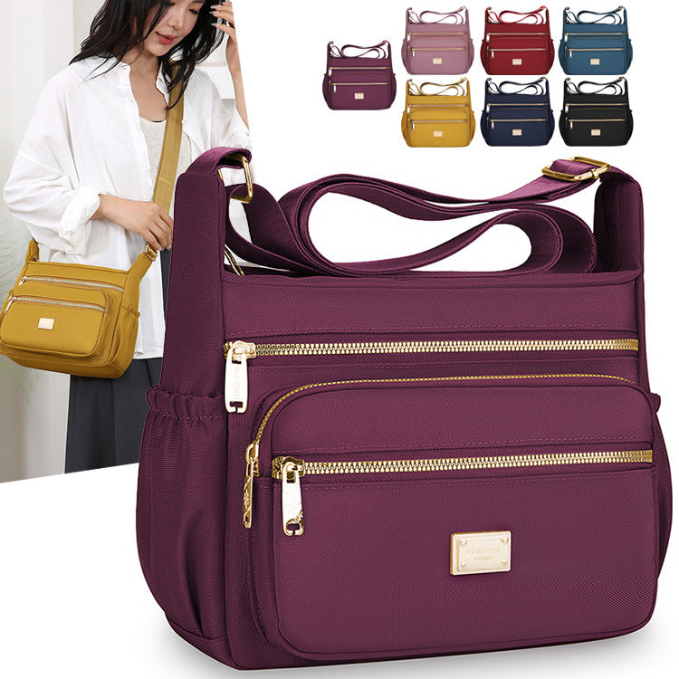 Women's bags are fashionable and simple, large-capacity messenger bags, multi-layer storage, travel shoulder bags, going out for commuting, middle-aged mother bags.