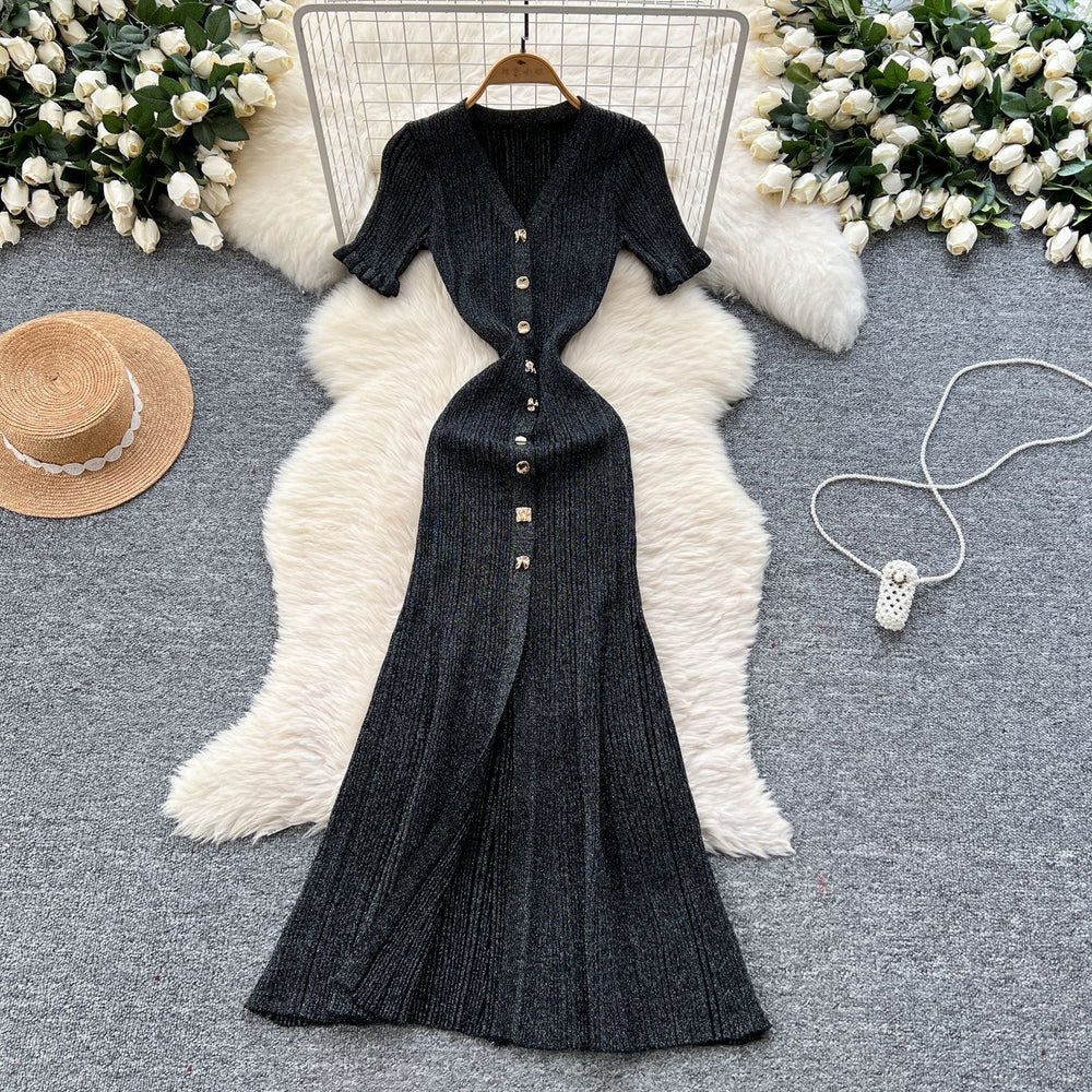 Elegant and sophisticated v-neck short-sleeve knit dress for women, perfect for summer. features a slimming, single-breasted design with a slit and shimmering silk details. a long, chic sweater dress