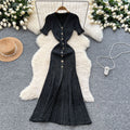 Elegant and sophisticated v-neck short-sleeve knit dress for women, perfect for summer. features a slimming, single-breasted design with a slit and shimmering silk details. a long, chic sweater dress