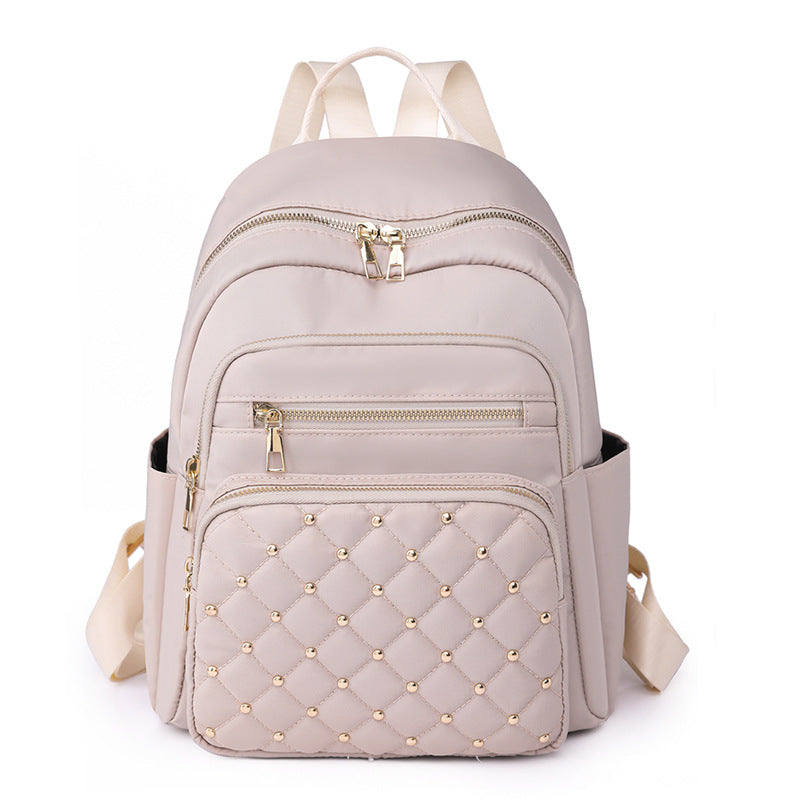 Solid color rhombus sewing line rivets fashion backpack women's 2025 texture Korean version large capacity simple women's backpack