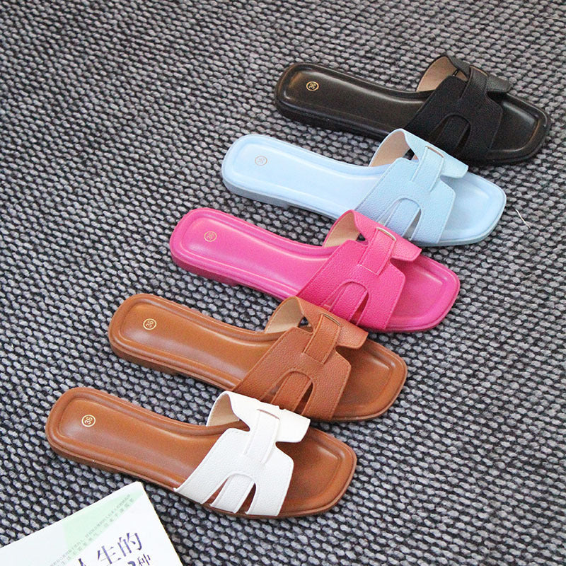 Hot selling Wholesale spot flat slippers women's beach shoes versatile fashion one-character sandals