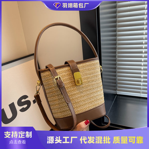 Woven straw bag women's 2023 new niche design messenger bag summer versatile high-end portable bucket bag