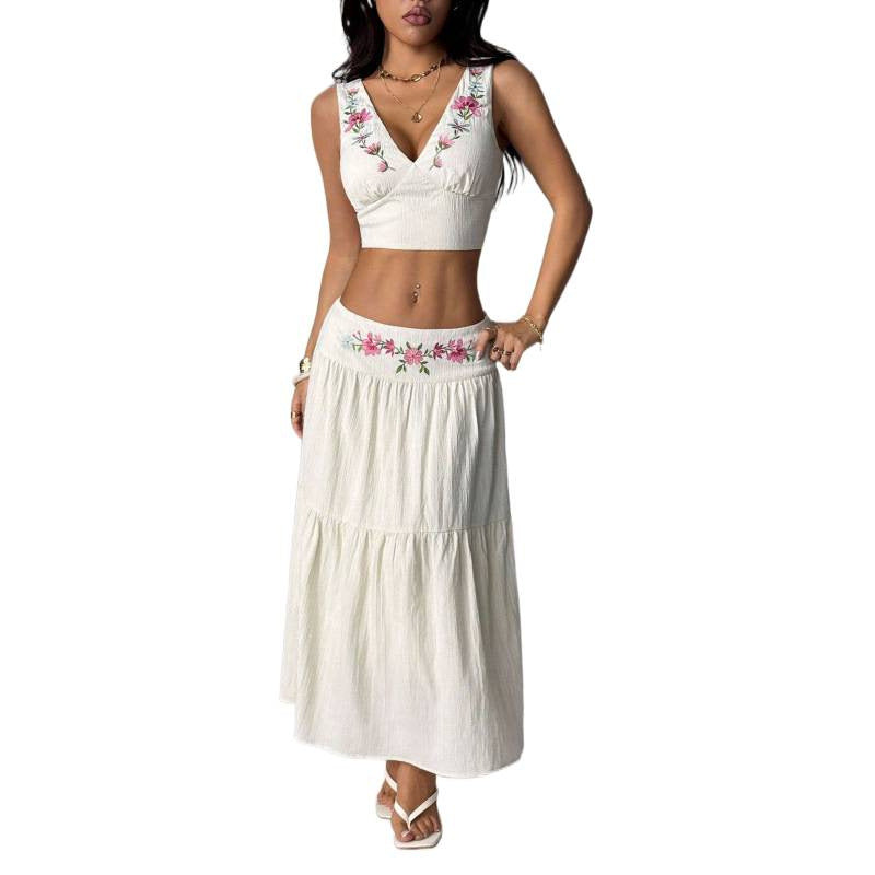 Women's embroidered v-neck sleeveless top and high-waisted a-line maxi skirt two-piece set, perfect for a stylish vacation look
