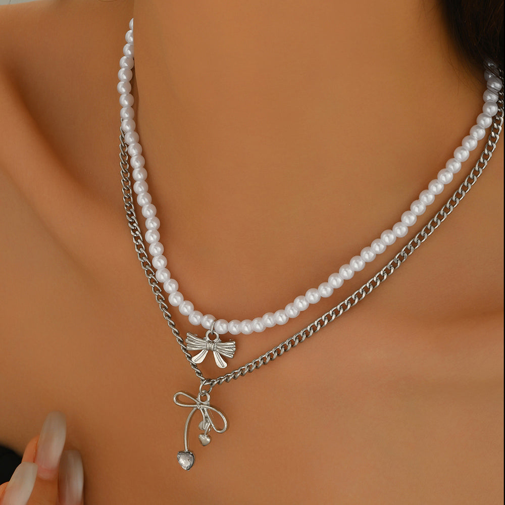 Sweater chain long wholesale european and american cross-border autumn and winter bow pendant stacking simple accessible luxury niche pearl necklace