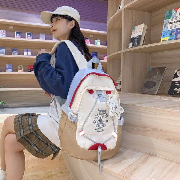 School bag female college student 2023 new large-capacity Korean version versatile contrasting backpack junior high school student high school backpack