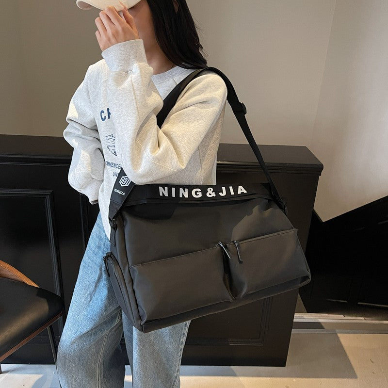 Sports fitness bag, men's and women's fashion, hand-held travel bag, multi-pocket short-distance luggage bag, crossbody boarding bag wholesale