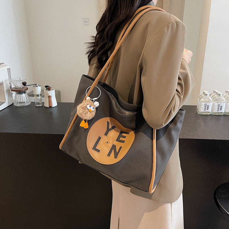 Canvas large capacity letter tote bag women's bag 2025 new casual simple handbag commuter versatile shoulder bag