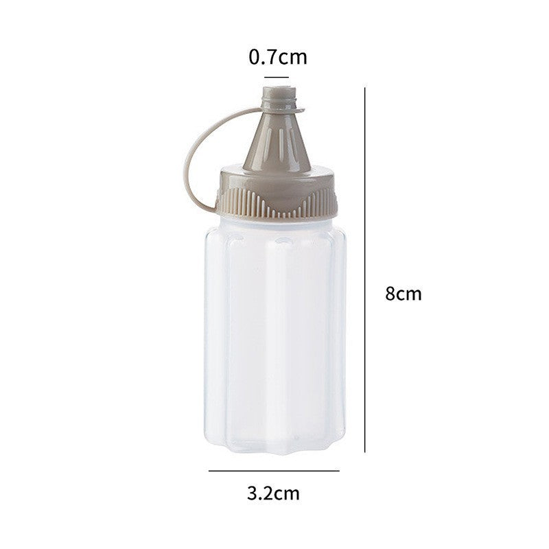 Four-piece seasoning set: transparent sauce dispenser bottles for outdoor bbq, kitchen spice jars, and condiment containers