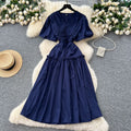 French-inspired, niche v-neck dress with ruched waist, puff sleeves, and a flowy, a-line silhouette. perfect for a slimming and elegant summer look