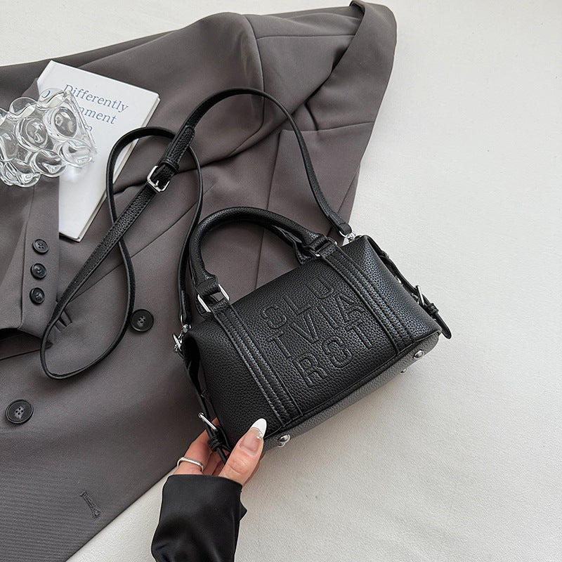 Fashion niche high-end sense embossed letter pillow bag 2025 new summer versatile color casual messenger bag