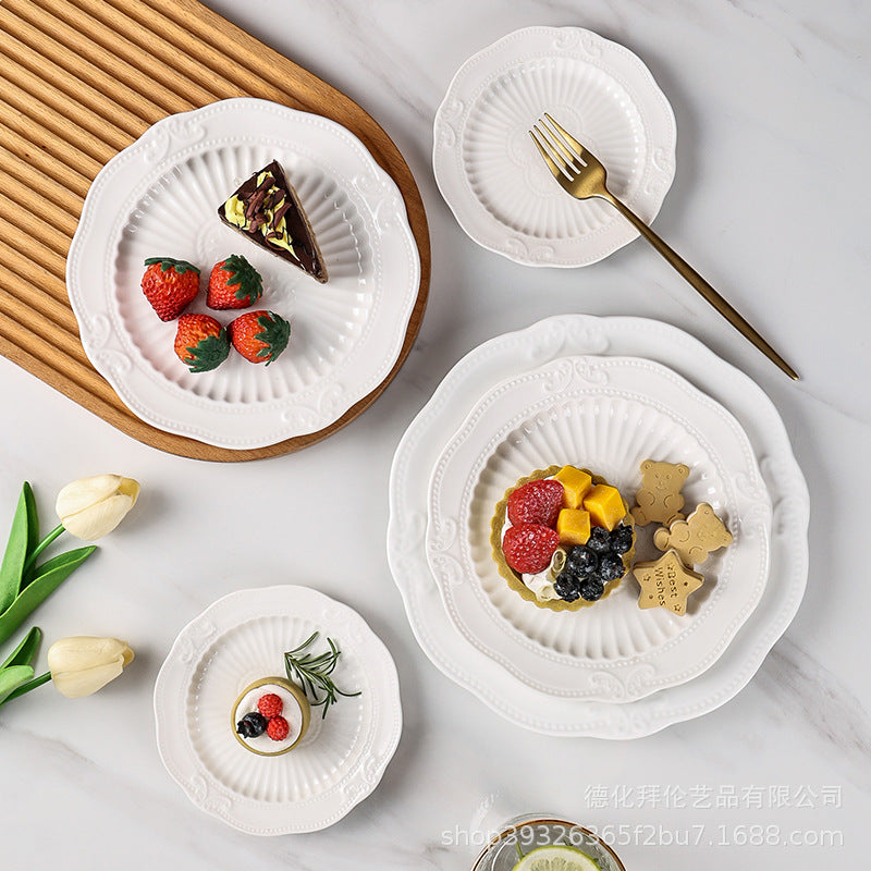 European-style pure white dessert plate, three-tier fruit platter, modern showroom display, creative embossed ceramic plate wholesale
