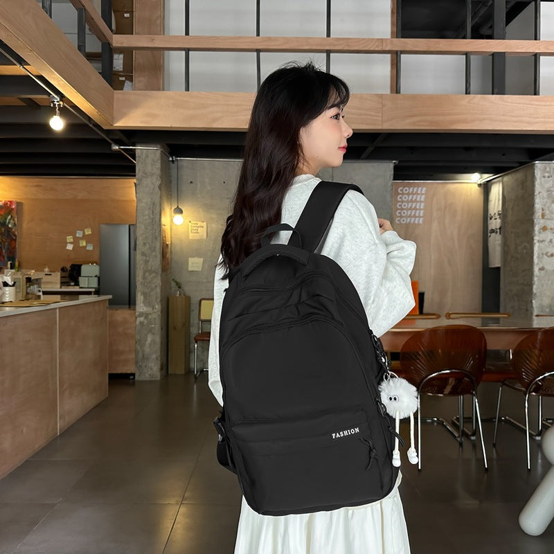 Large capacity burden reduction solid color backpack male junior high school student primary school bag female simple versatile travel backpack