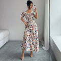 new european and american style floral midi dress with square neck, puff short sleeves, ruched bust, and a-line silhouette