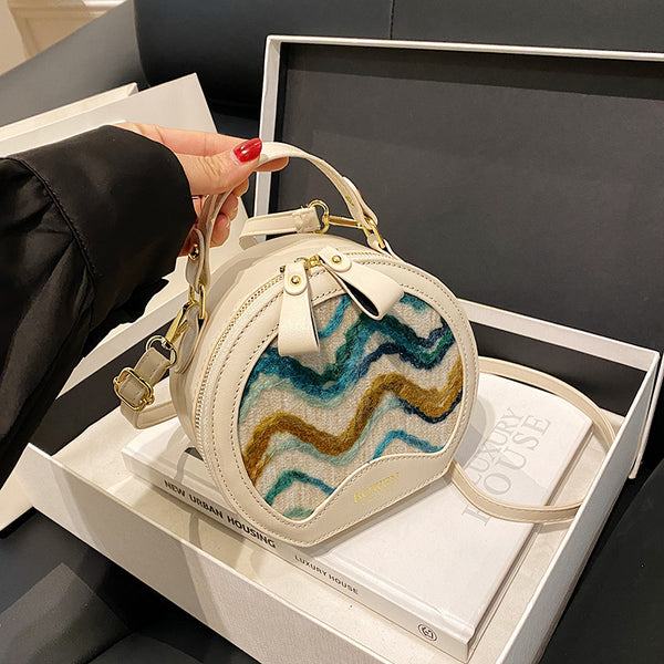 This year's popular bag women's 2025 new wavy pattern small round bag Korean version fashionable personalized portable shoulder bag women's bag