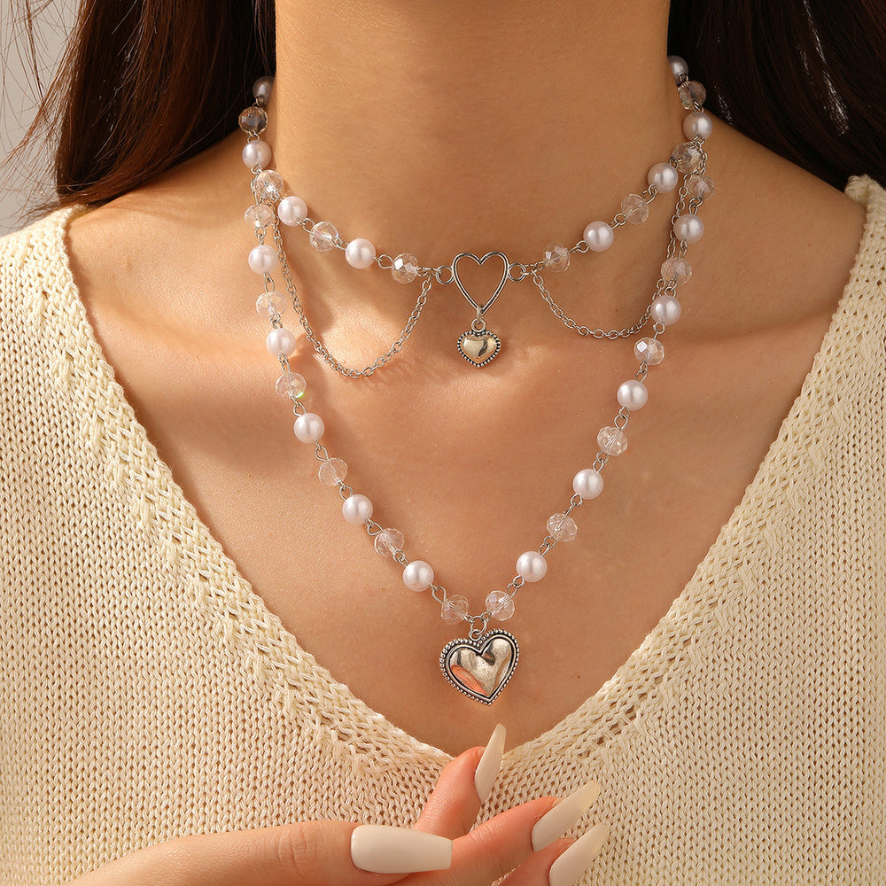 Wholesale faux pearl chains: cross-border fashion, niche, high-end, gothic style heart pendant necklace, sweater chain accessories