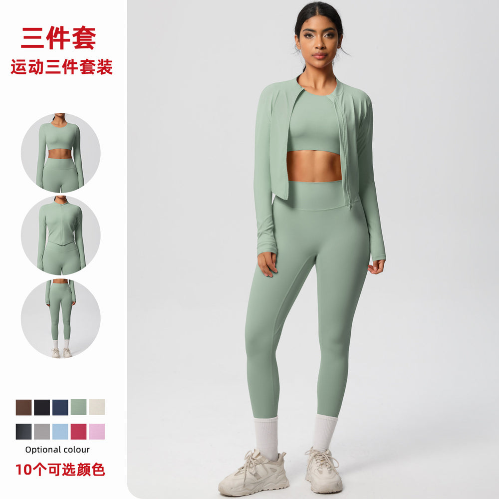 High-waisted, form-fitting yoga pants, a barely-there feel, quick-drying outer layer, and a long-sleeved tee – a women's three-piece activewear set perfect for running and workouts