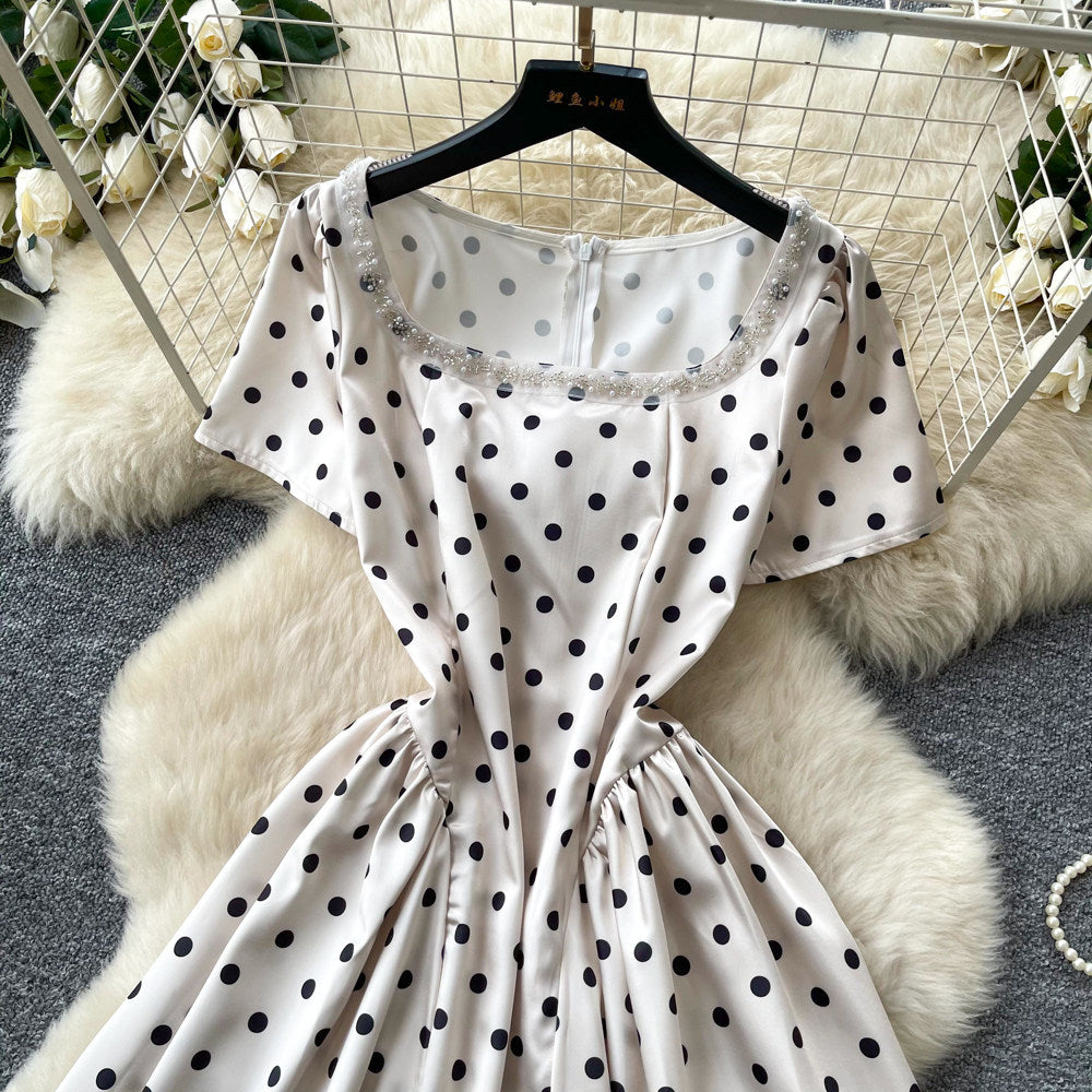 French chic polka dot dress - effortless summer style: square neck, cinched waist, slimming a-line for petite figures