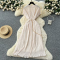 French-inspired v-neck floral chiffon dress with flared sleeves, tie waist, and a figure-flattering, vintage-inspired silhouette