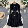 French chic, high-end, luxurious knitted dress with heavily embellished metal buckle – perfect for autumn/winter, featuring a cinched waist and ideal as a layering piece