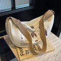 Niche style canvas bag for women 2024 spring and summer new arrivalcasual large capacity student shoulder work clothing bag crossbody dumpling bag