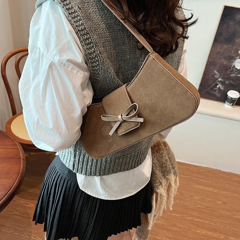 Red bag women's bag 2025 new shoulder baguette bag Korean version fashion minimalist niche bow armpit bag