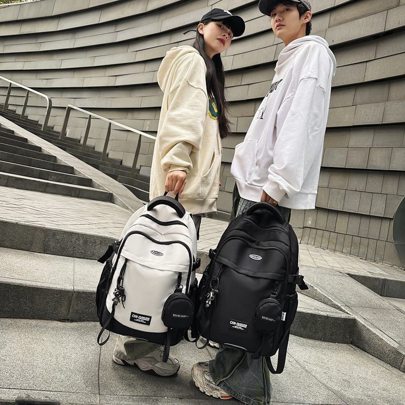 New large-capacity backpack, animation pattern graffiti, student schoolbag, trendy casual backpack, commuter bag, men's and women's models