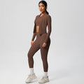 High-waisted, form-fitting yoga pants, a barely-there feel, quick-drying outer layer, and a long-sleeved tee – a women's three-piece activewear set perfect for running and workouts
