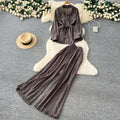 Sophisticated, niche design two-piece set for women: a long-sleeved, tie-waist blouse with a bow detail, paired with high-waisted, wide-leg pants