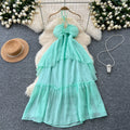Beach vacation dress for women, atmospheric cut out, breast-revealing halter suspender, stereo flower, asymmetrical fairy long skirt