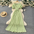 French-inspired pleated, waist-cinching, slimming dress for women. red, tie-waist, elegant, and flowy maxi dress, perfect for the office