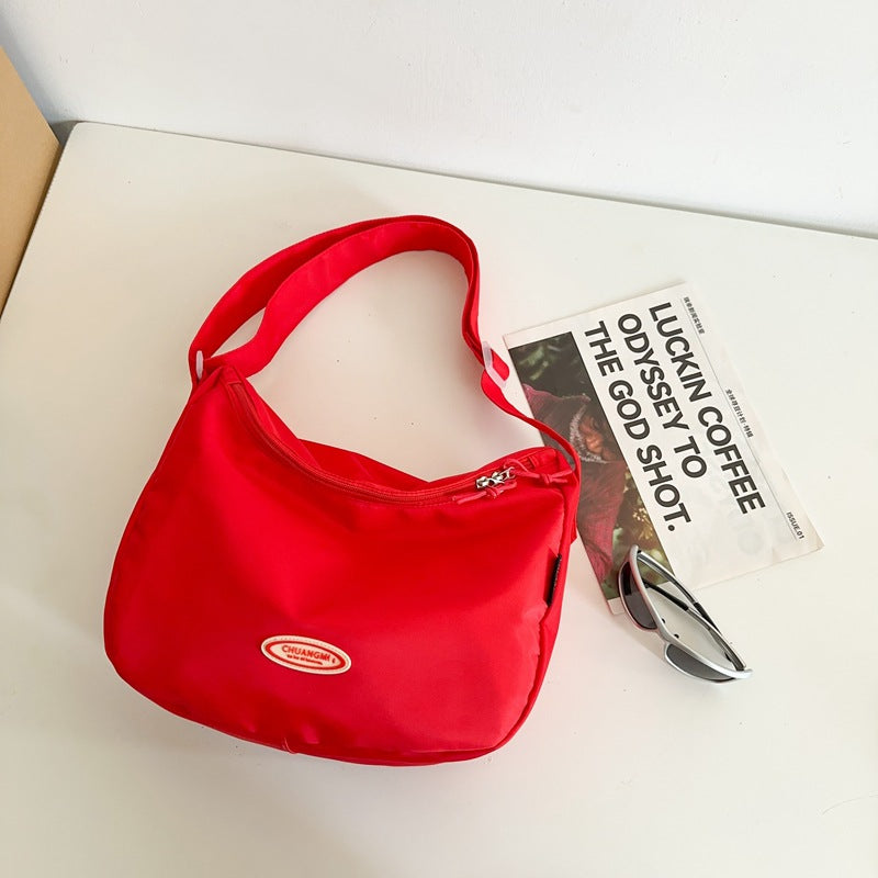 Foreign single nylon cloth bag women's large capacity 2025 new summer versatile shoulder messenger bag casual commuter dumpling bag
