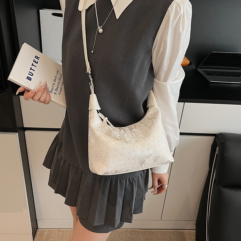 New Chinese style national style portable small bag women's 2025 summer new bento bag design sense personalized commuter messenger bag