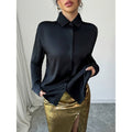 Women's two-piece set: long-sleeve button-down shirt and metallic high-waisted slit maxi skirt outfit, perfect for a night out