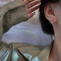 Tulip flower pearl stud earrings - trendy, versatile, chic, and dainty. sterling silver needle wholesale earrings - accessible luxury