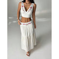 Women's embroidered v-neck sleeveless top and high-waisted a-line maxi skirt two-piece set, perfect for a stylish vacation look