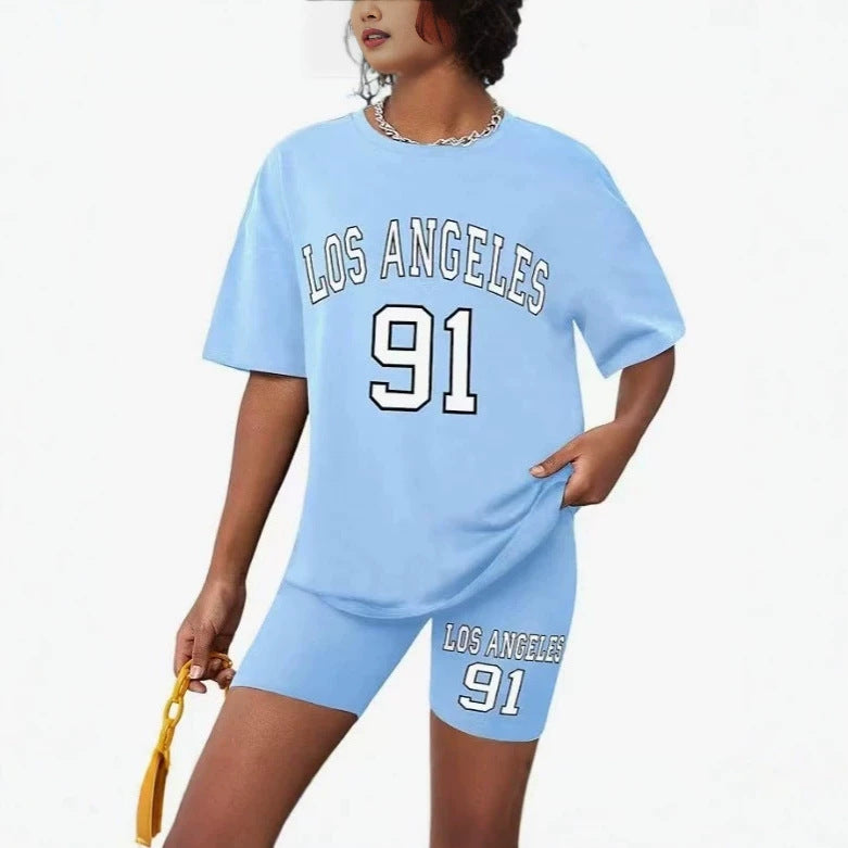 Girls' t-shirt and shorts set featuring a cartoon short-sleeve design and printed graphics, perfect for casual streetwear