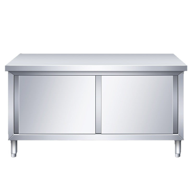 Commercial kitchen workstation: stainless steel countertop with sliding door, cutting board storage, and prep table for restaurants