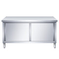 Commercial kitchen workstation: stainless steel countertop with sliding door, cutting board storage, and prep table for restaurants