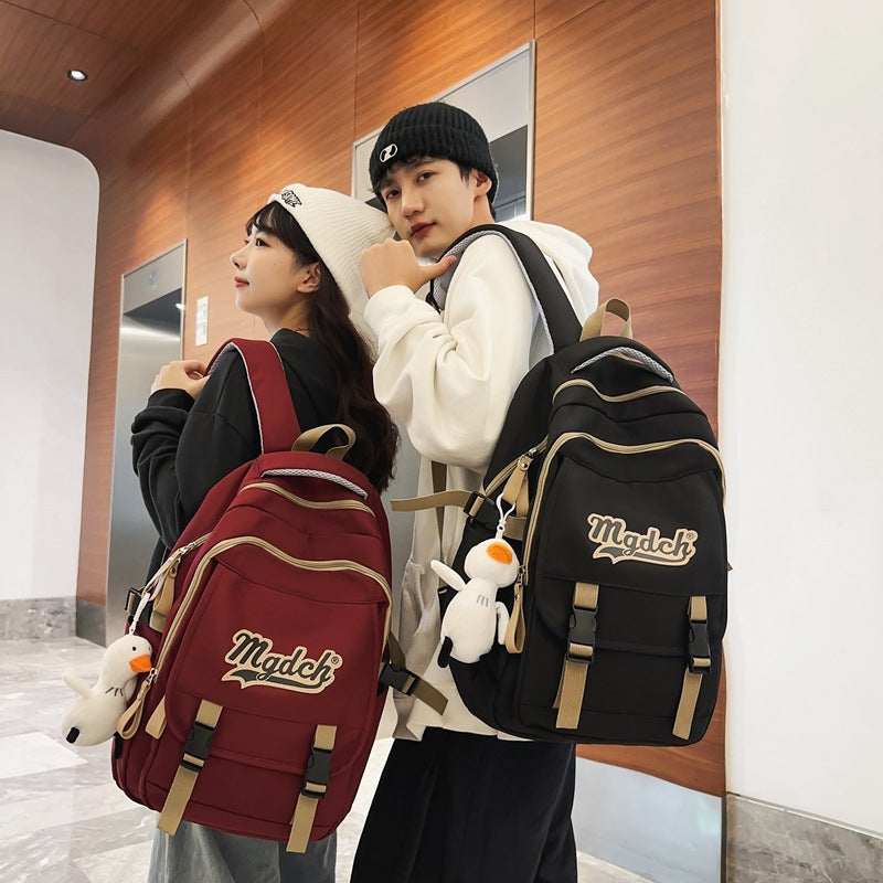 School bag for female college students, Korean version for junior high school students, high school, large-capacity burden reduction backpack for men's middle school students, casual backpack.