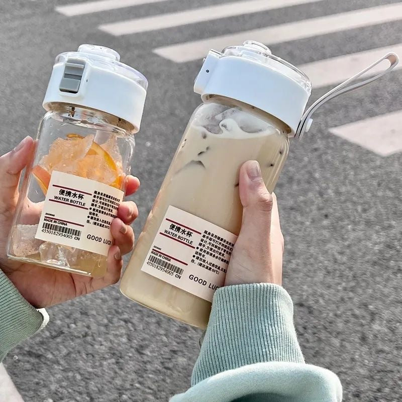 Muji-inspired plastic water bottle, stylish and minimalist design for students, travel-friendly with tea infuser and handle, perfect for outdoor use