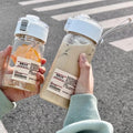Muji-inspired plastic water bottle, stylish and minimalist design for students, travel-friendly with tea infuser and handle, perfect for outdoor use